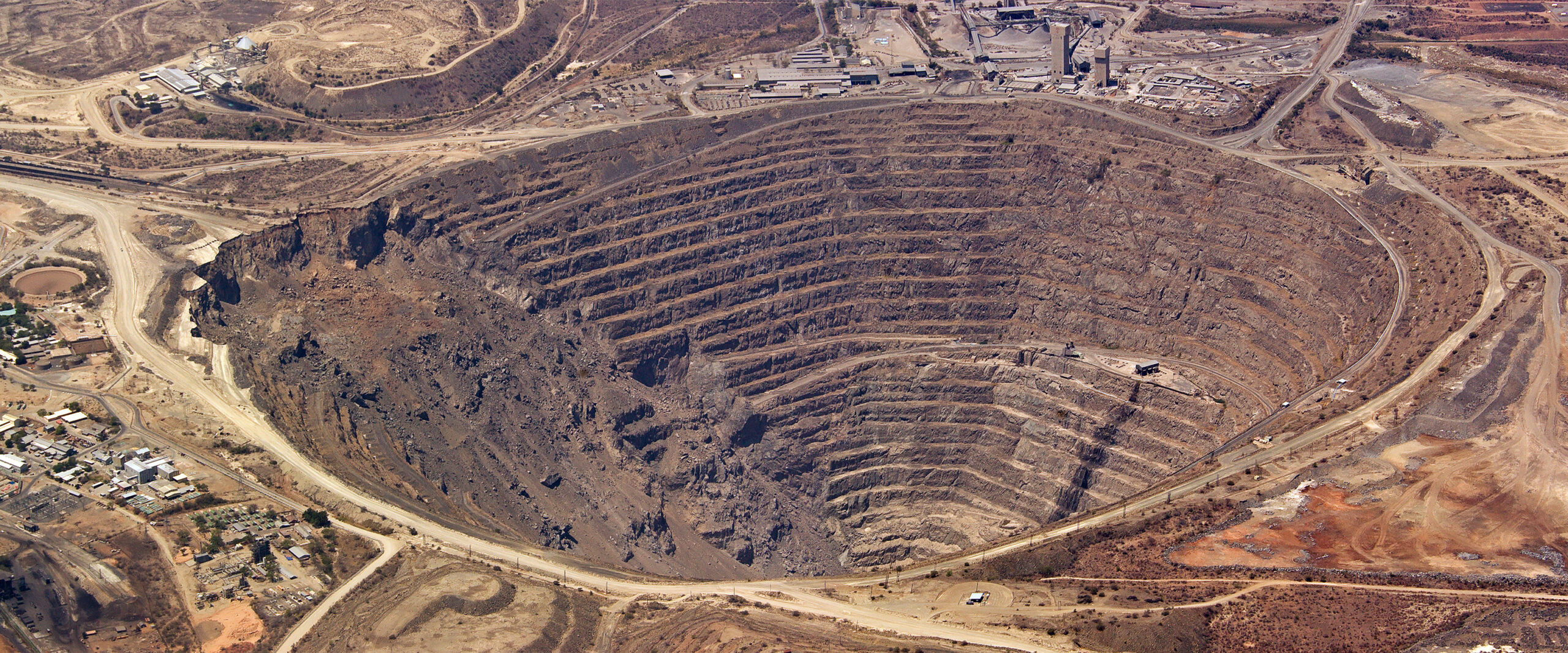 Aerial view of enormous copper mine at unknown locaation